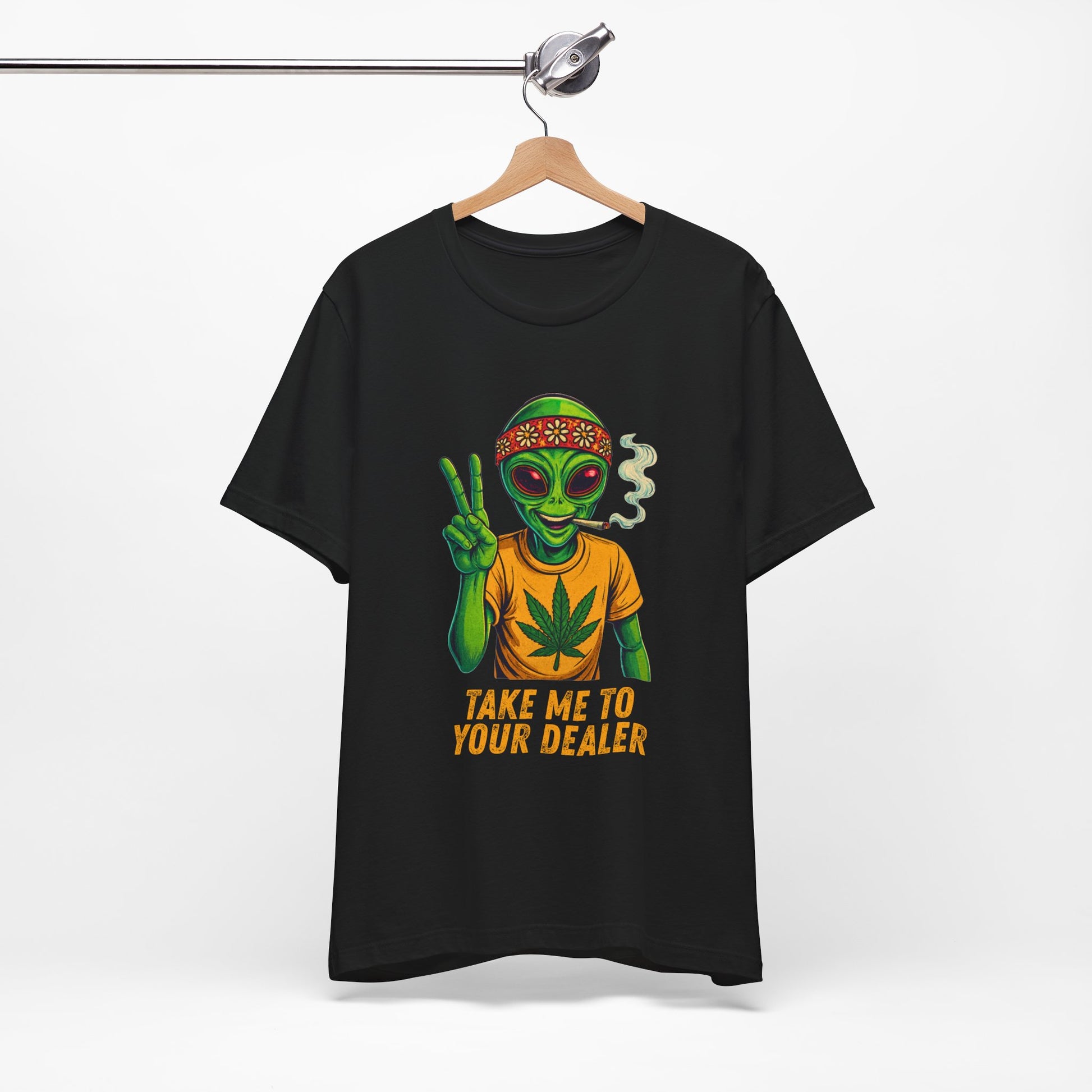 Black 420 stoner t-shirt with alien graphic and text 'Take me to your dealer' on a hanger against a white background