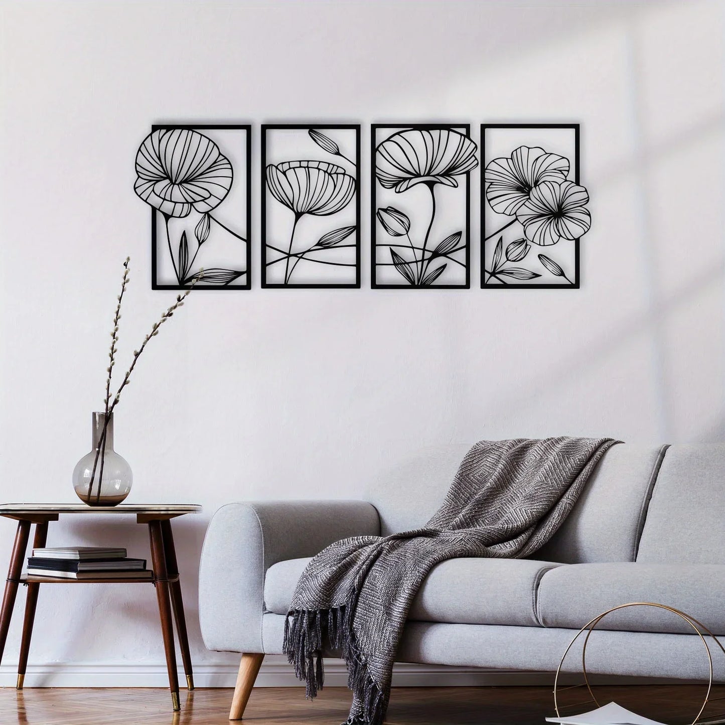 Floral wall art set above a sofa in a living room