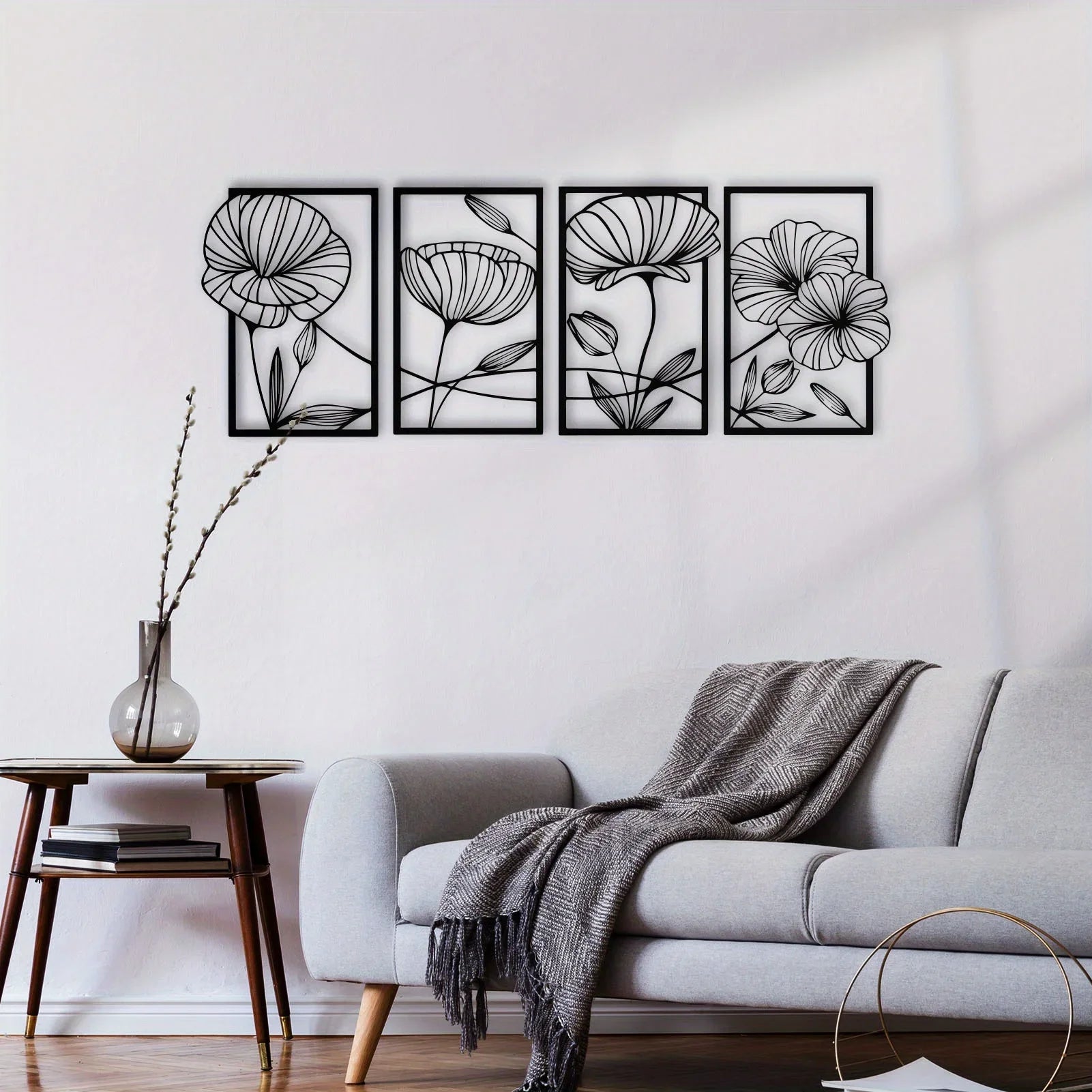 Floral wall art set above a sofa in a living room