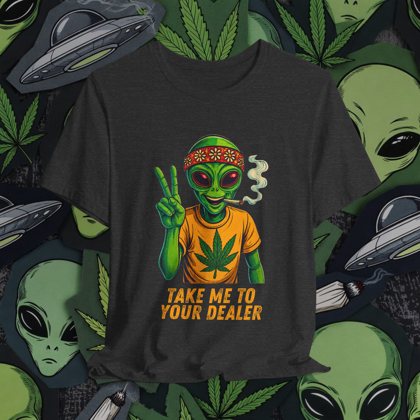 Black t-shirt with alien graphic and 'Take Me to Your Dealer' text on a background with aliens, marijuana leaves, and UFOs.