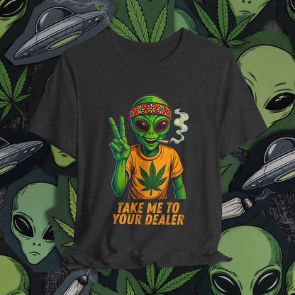 Black t-shirt with alien graphic and 'Take Me to Your Dealer' text on a background with aliens, marijuana leaves, and UFOs.